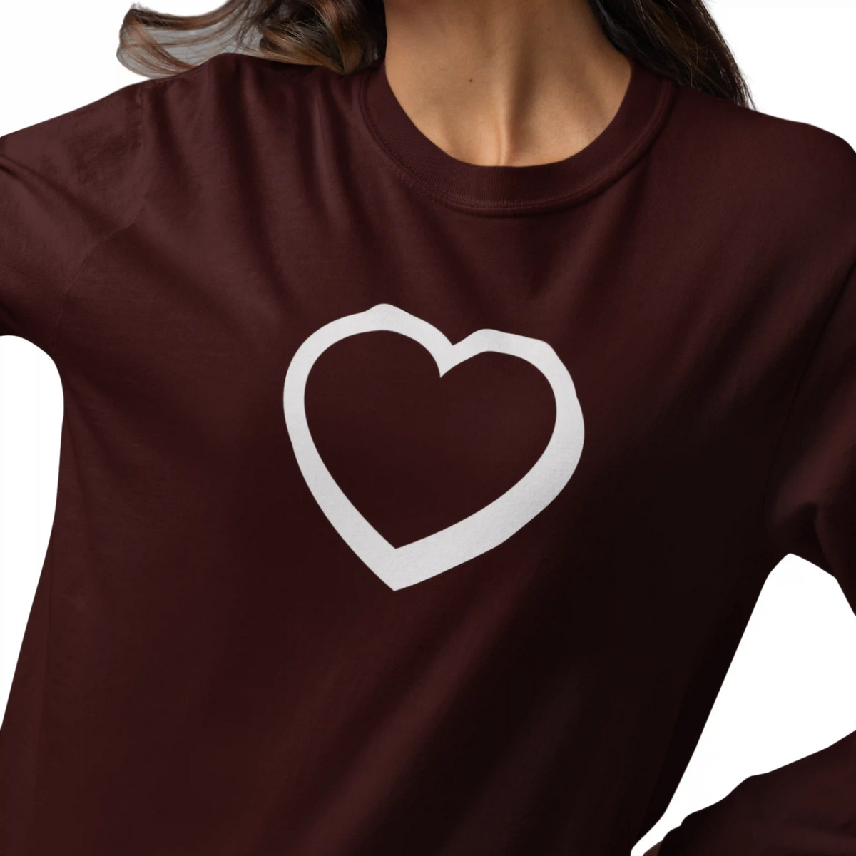 Brown sweatshirt with a white heart design on a plain background