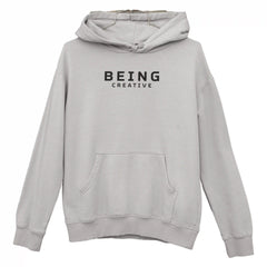 Gray hoodie with 'BEING CREATIVE' text on a white background