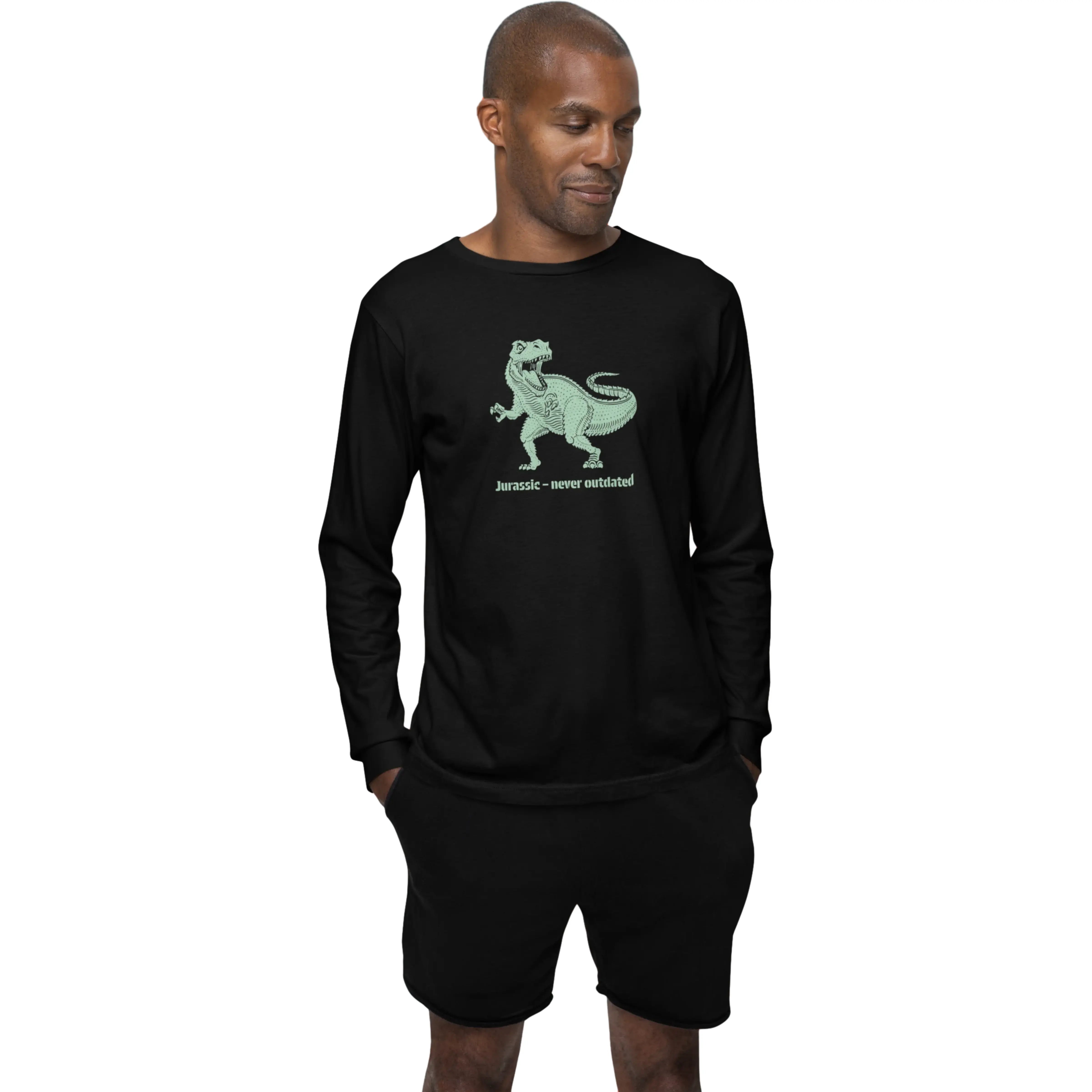 Man wearing a black long-sleeve shirt with a green dinosaur graphic and text on a white background